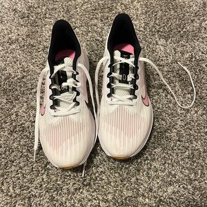 Women’s size 8.5 Nike running shoes (excellent condition).